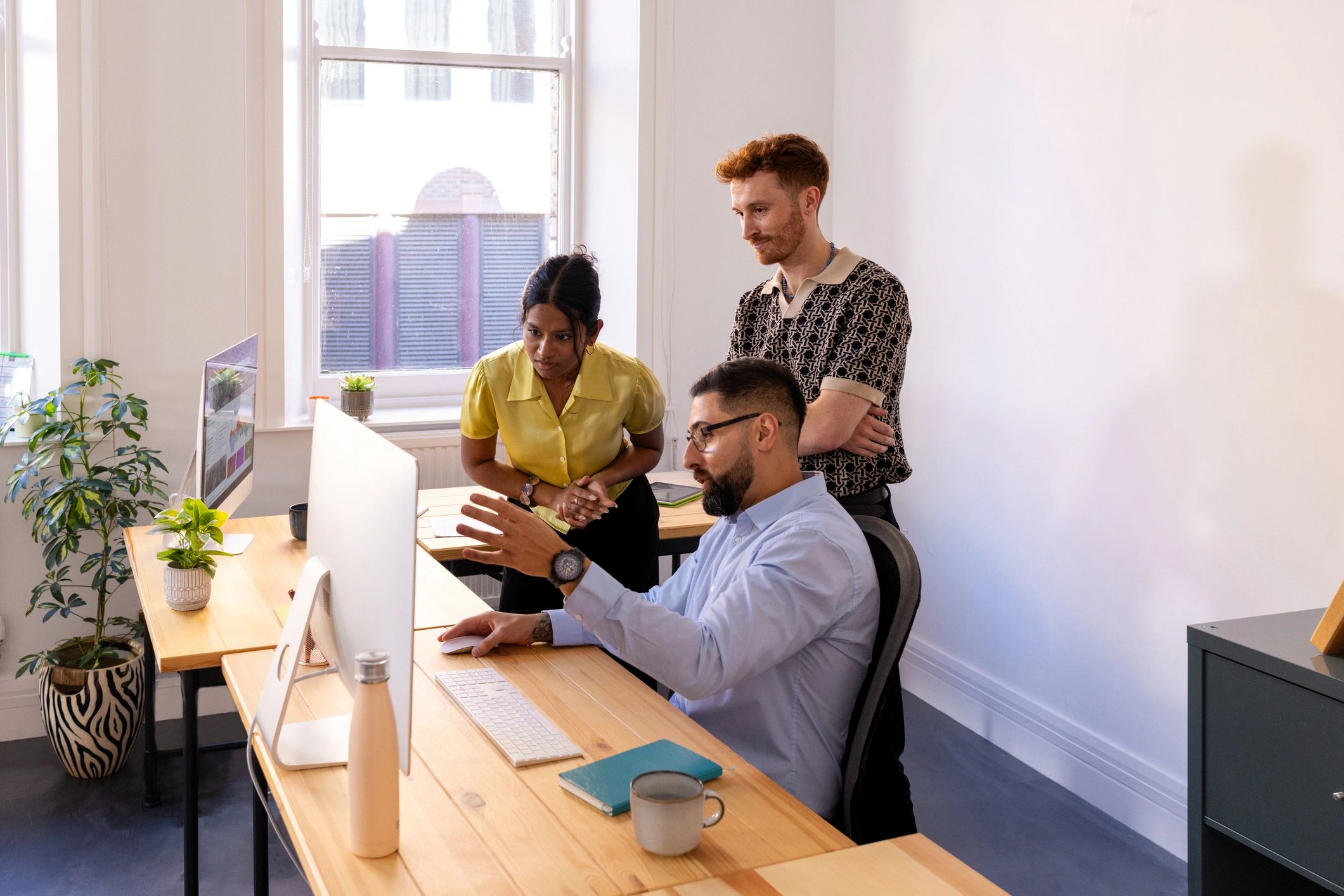Team members collaborating in a modern office